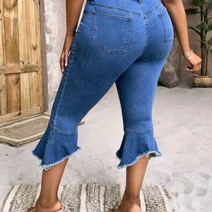 Medium wash plus size Height waist Raw cut flare leg jeans